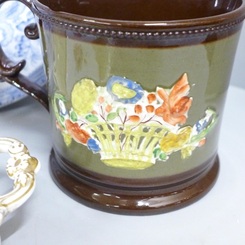 787 - A Victorian copper lustre jug with deer detail and a large mug with floral detail, a blue and white ... 