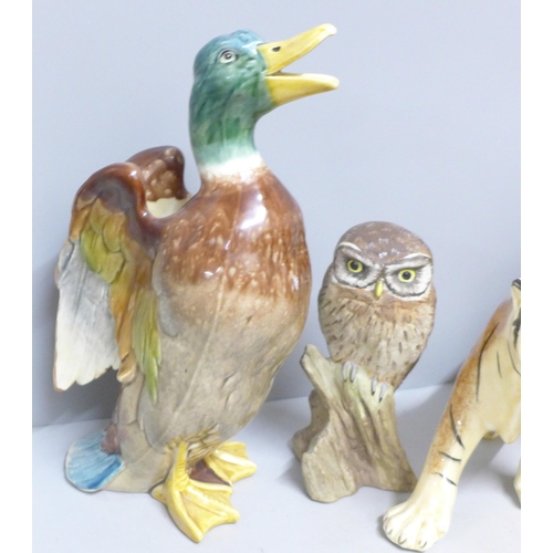 788 - A Beswick fireside Yorkie 2377, a/f, right ear chipped, a model of an owl, signed M. Booth for Acorn... 