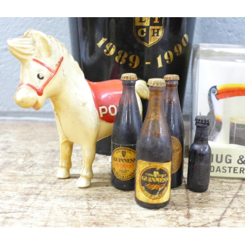 789 - A large pottery Guinness pint glass money bank, one smaller, a Guinness mug and coaster set, boxed, ... 