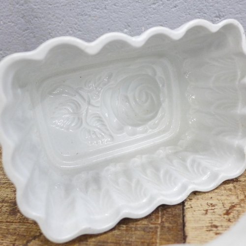 792 - Seven large ceramic jelly moulds including hen, rabbits, fish, rose and lion, two marked Green's and... 