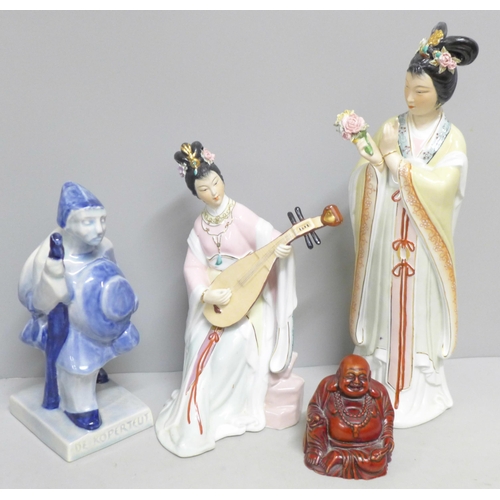 793 - A Delft figure, two oriental figures and a Buddha figure