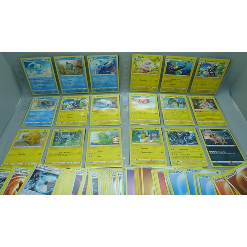 801 - Over 300 Pokemon cards in protective sleeves