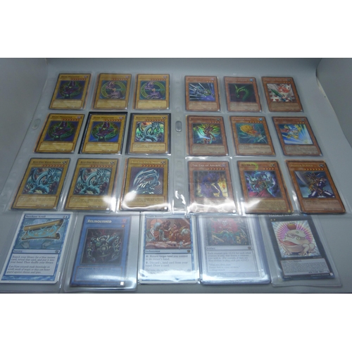 803 - 40 Yu Gi Oh cards and Magic of The Gathering, including first editions and Holos, cards include five... 