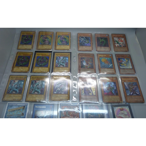 803 - 40 Yu Gi Oh cards and Magic of The Gathering, including first editions and Holos, cards include five... 