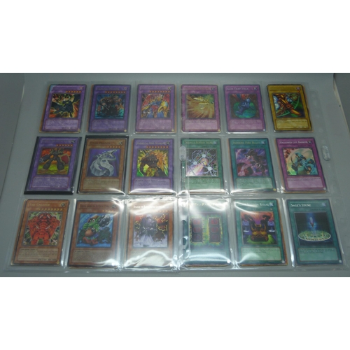 803 - 40 Yu Gi Oh cards and Magic of The Gathering, including first editions and Holos, cards include five... 