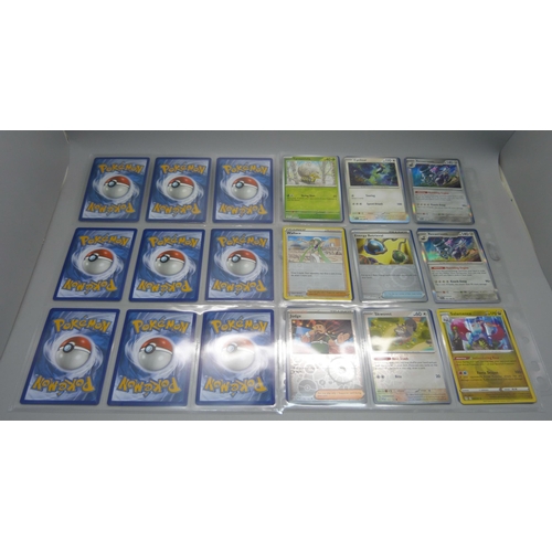 804 - 99 Holographic Pokemon cards from different sets, all in protective sleeves