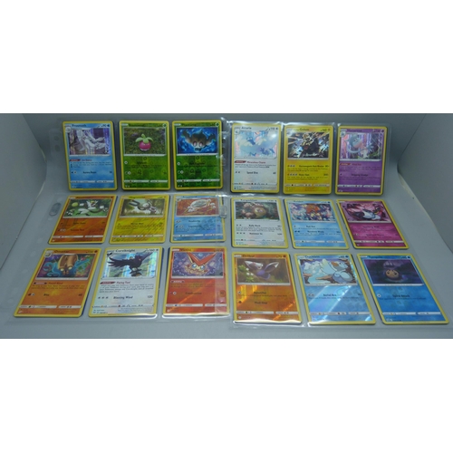 804 - 99 Holographic Pokemon cards from different sets, all in protective sleeves