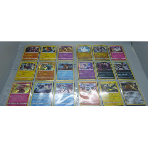 804 - 99 Holographic Pokemon cards from different sets, all in protective sleeves