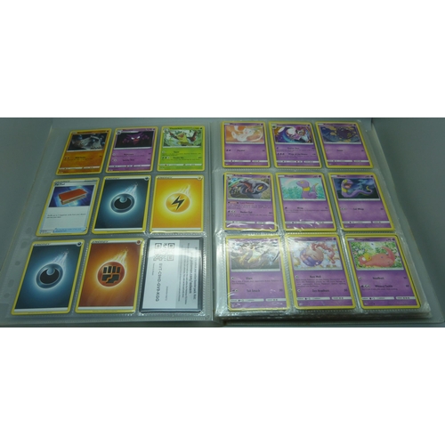 808 - A Pokemon folder with over 400 cards including holographic