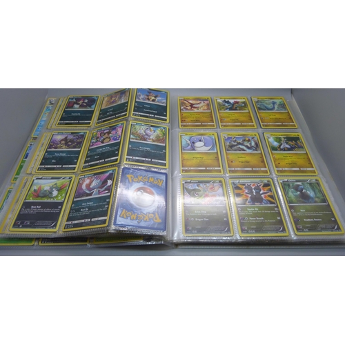 808 - A Pokemon folder with over 400 cards including holographic