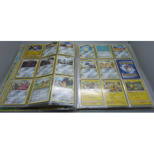 808 - A Pokemon folder with over 400 cards including holographic