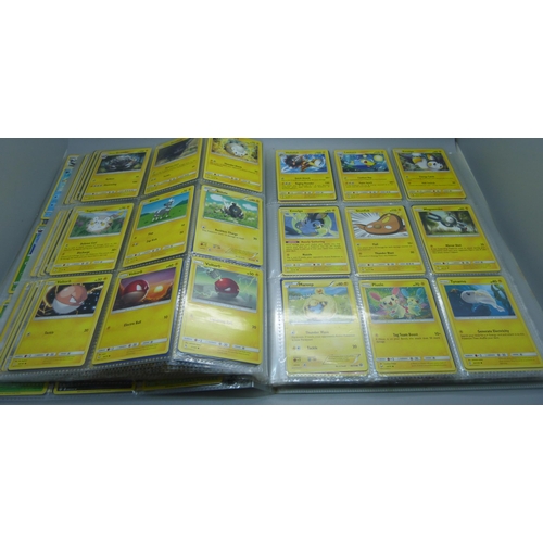 808 - A Pokemon folder with over 400 cards including holographic