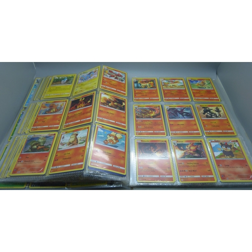 808 - A Pokemon folder with over 400 cards including holographic