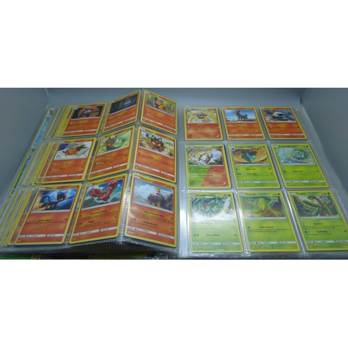 808 - A Pokemon folder with over 400 cards including holographic