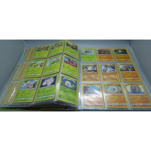 808 - A Pokemon folder with over 400 cards including holographic