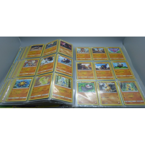 808 - A Pokemon folder with over 400 cards including holographic