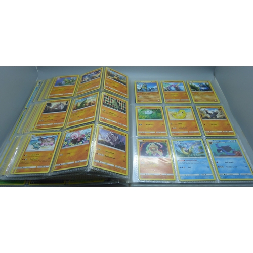 808 - A Pokemon folder with over 400 cards including holographic