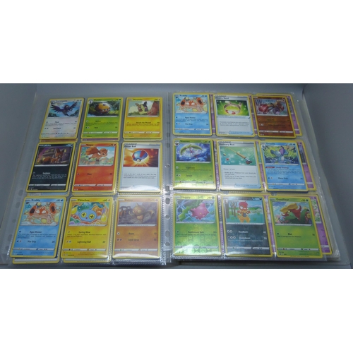 808 - A Pokemon folder with over 400 cards including holographic