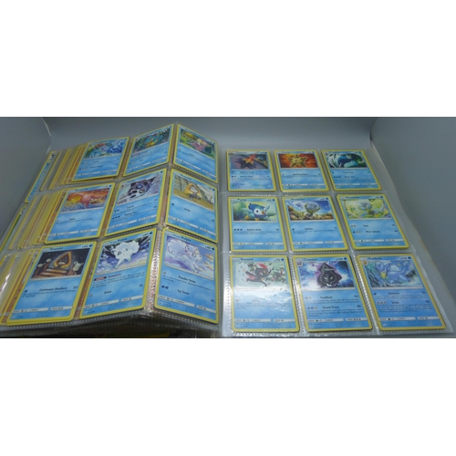 808 - A Pokemon folder with over 400 cards including holographic