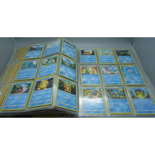 808 - A Pokemon folder with over 400 cards including holographic