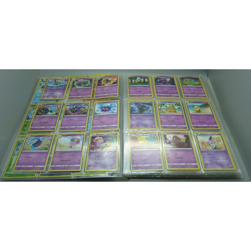 808 - A Pokemon folder with over 400 cards including holographic