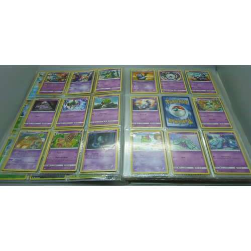 808 - A Pokemon folder with over 400 cards including holographic