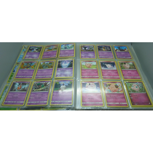 808 - A Pokemon folder with over 400 cards including holographic