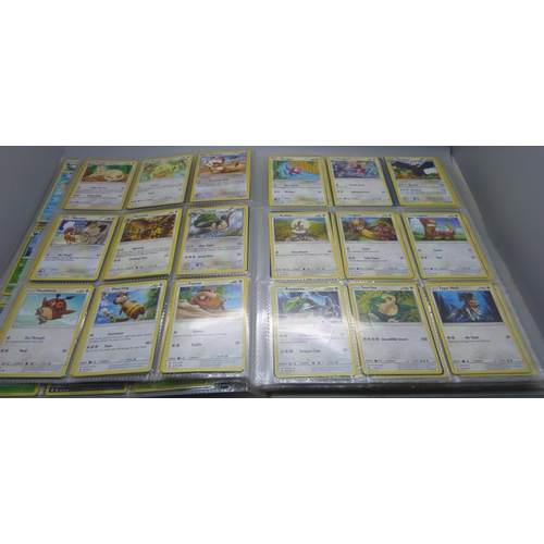 808 - A Pokemon folder with over 400 cards including holographic