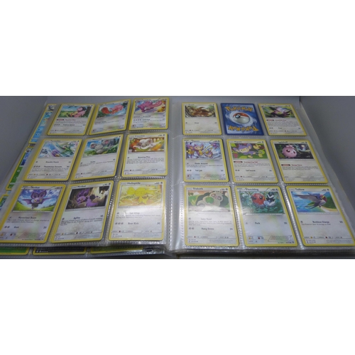 808 - A Pokemon folder with over 400 cards including holographic