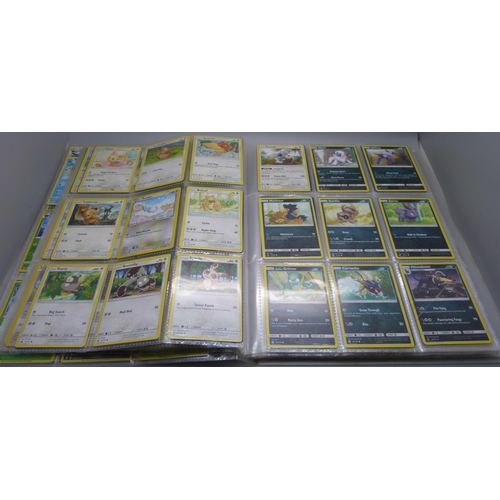 808 - A Pokemon folder with over 400 cards including holographic