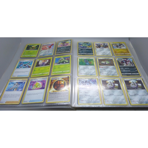 809 - A Pokemon card folder with 396 cards including holographic