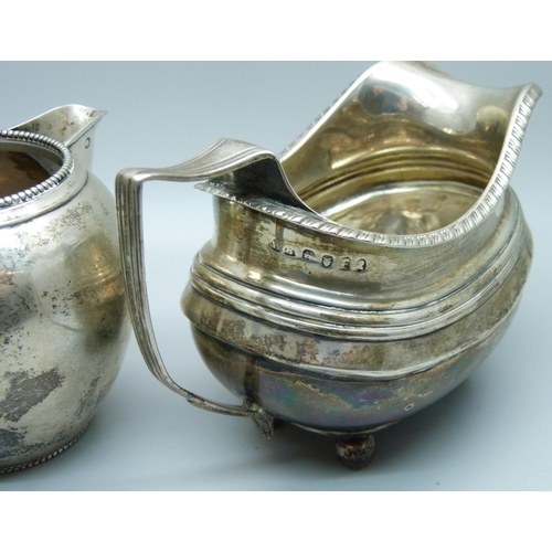 814 - A continental silver jug with foreign control marks and a 19th Century silver cream jug, a/f, repair... 