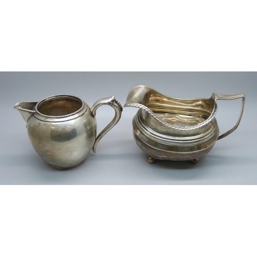 814 - A continental silver jug with foreign control marks and a 19th Century silver cream jug, a/f, repair... 