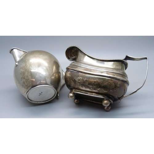 814 - A continental silver jug with foreign control marks and a 19th Century silver cream jug, a/f, repair... 