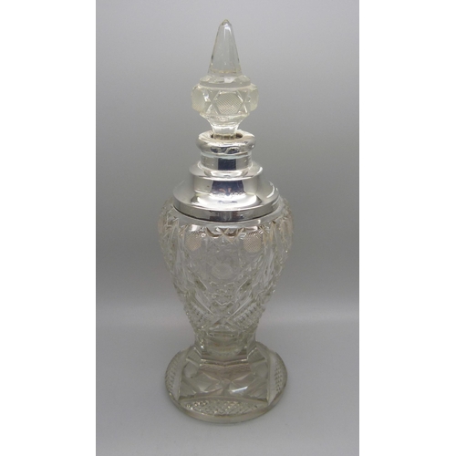 823 - A cut glass scent bottle with silver collar, collar dented, 23.5cm