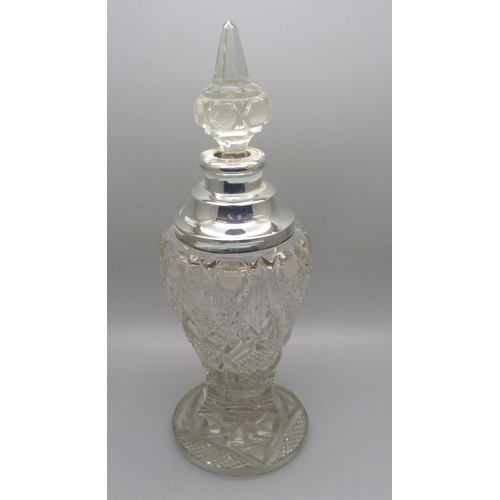 823 - A cut glass scent bottle with silver collar, collar dented, 23.5cm