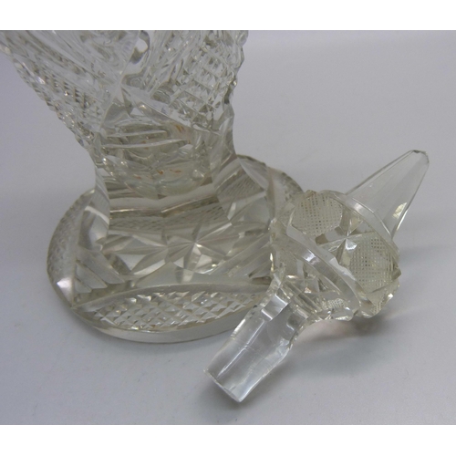 823 - A cut glass scent bottle with silver collar, collar dented, 23.5cm