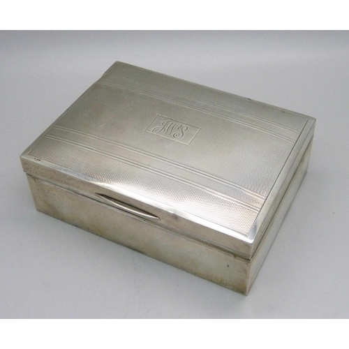 828 - A silver cigarette box, Birmingham 1949, total weight with liner 326g, 11.5cm wide