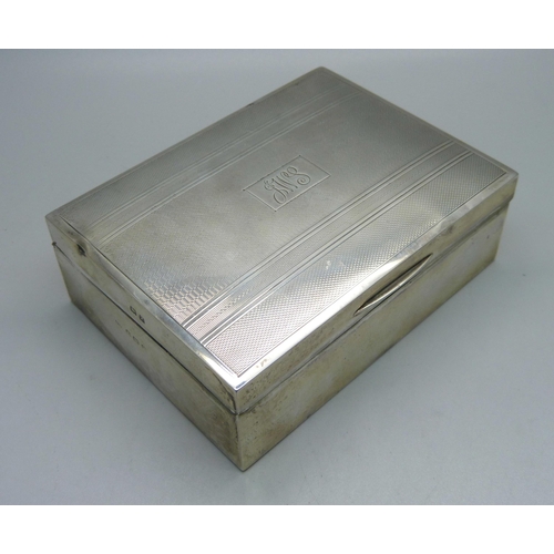 828 - A silver cigarette box, Birmingham 1949, total weight with liner 326g, 11.5cm wide