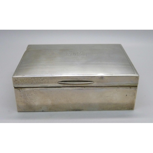 828 - A silver cigarette box, Birmingham 1949, total weight with liner 326g, 11.5cm wide