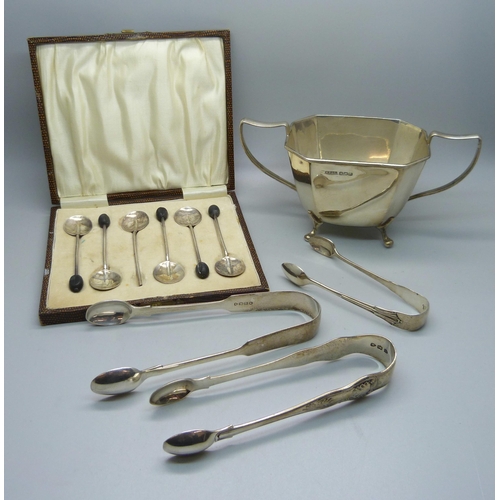 835 - Three pairs of silver sugar bows, a silver sugar bowl and six silver coffee bean spoons, (one a/f), ... 