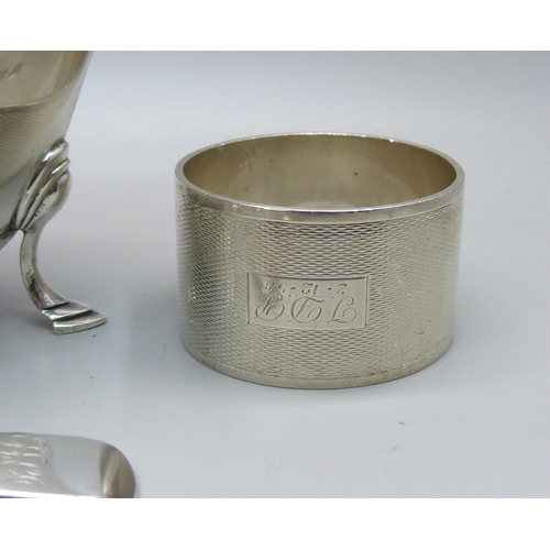 841 - A silver sauce boat, two silver napkin rings, a pair of silver mustard spoons and one other silver m... 