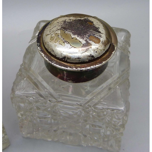 842 - Two silver topped glass inkwells