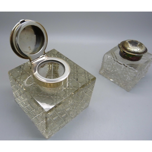 842 - Two silver topped glass inkwells