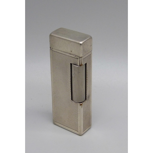 851 - A vintage silver plated Dunhill lighter with engine turned detail