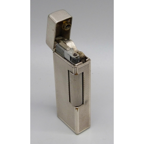 851 - A vintage silver plated Dunhill lighter with engine turned detail