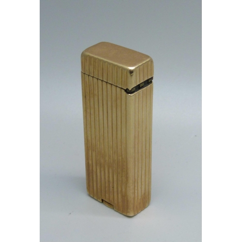 853 - A 14ct gold cased Dunhill lighter, marked 'Outer Jacket 14K Gold'