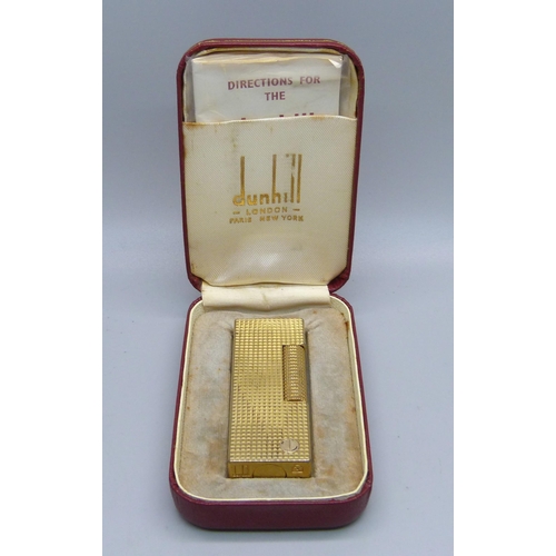 854 - A Dunhill lighter, boxed, with instructions