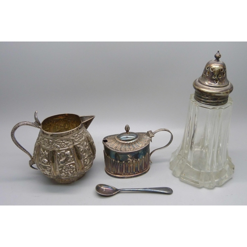 856 - A Victorian silver mustard, 48g, (plated spoon), an Indian white metal jug with snake handle, 102g, ... 