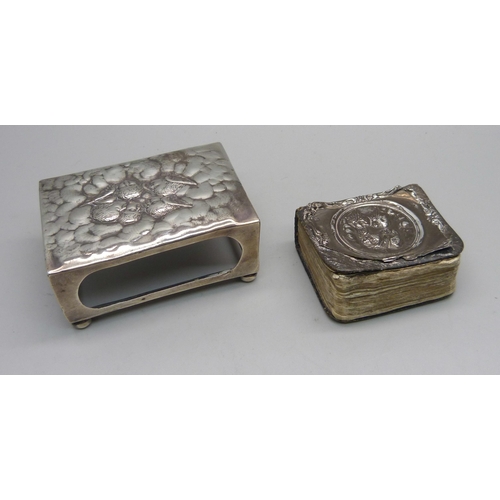 857 - A silver matchbox holder and a prayer book with silver cover, a/f, both with Reynolds Angels detail,... 